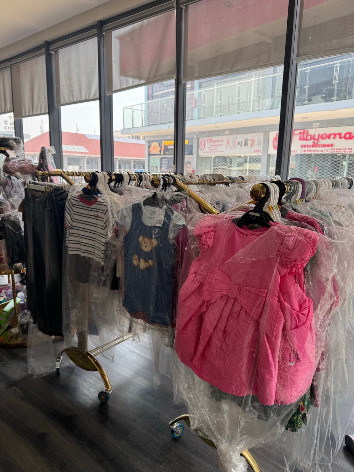 Inside view of Theo Kiddies store showing organized kidswear racks